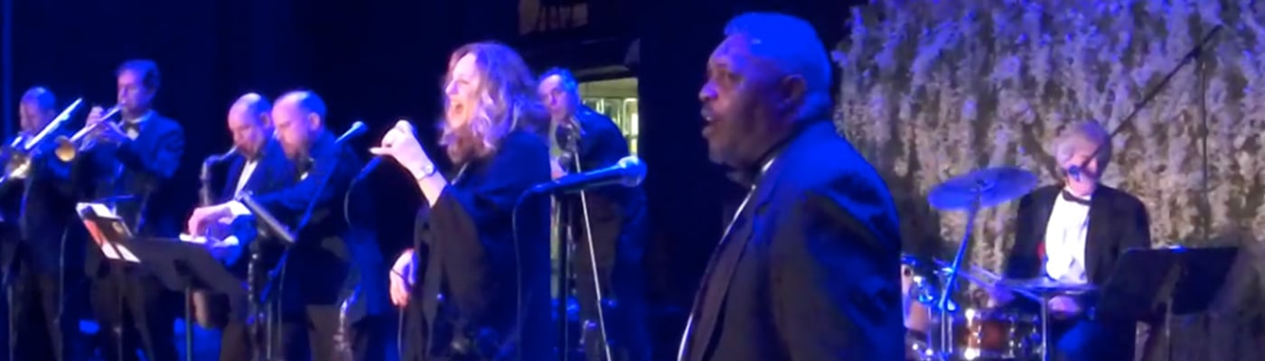 Debbie Major fronting the horn section